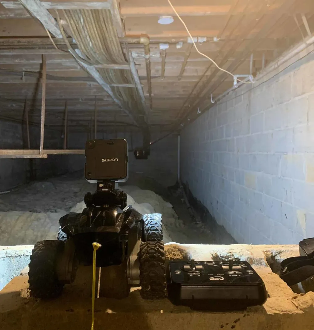Inspection rover with a camera, ready to enter a crawlspace